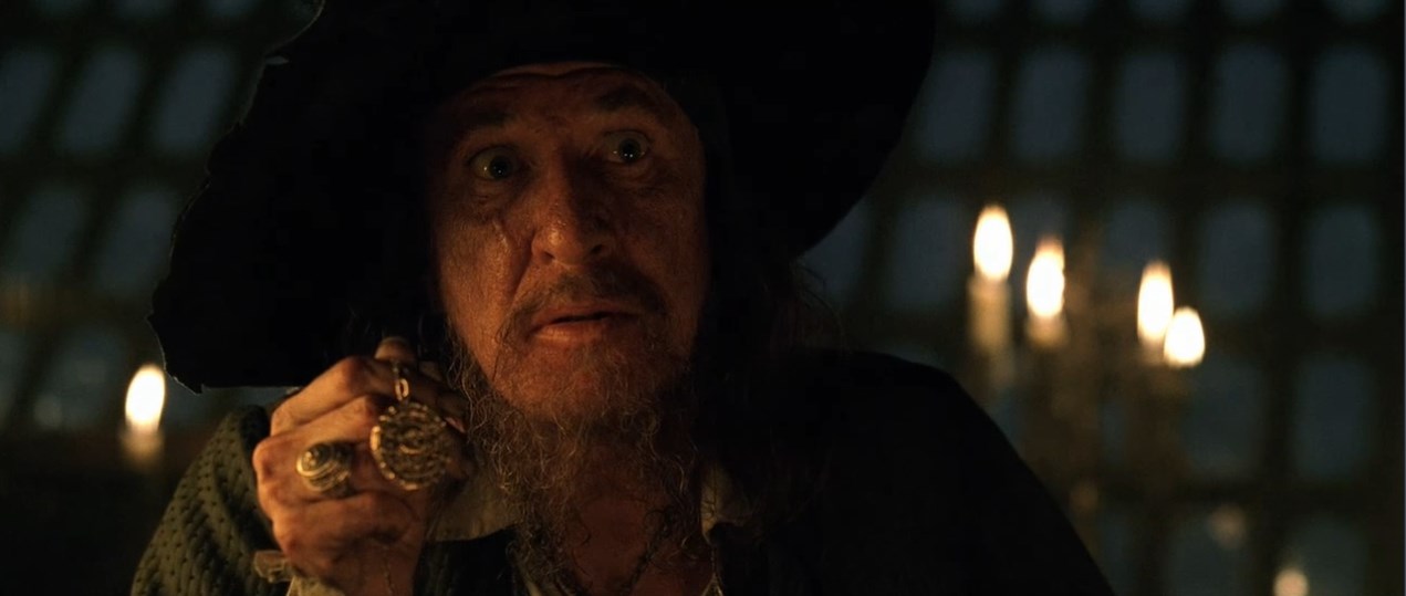 — Вы не знаете, что это такое? Верно?
— Пиратский медальон.
— Это ацтекское золото, одна из шестисот шестидесяти трёх бляшек, что индейцы отнесли Кортесу как выкуп... выкуп за кровь, доставленный с надеждой положить конец расправам. Но алчность Кортеса была неутолима, и тогда языческие боги придумали страшное проклятие. Любой из смертных, кто возьмёт хоть одну золотую бляшку, обречён на вечные муки.